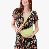 Shadow Lime Small | Model wearing half circle shaped sling bag