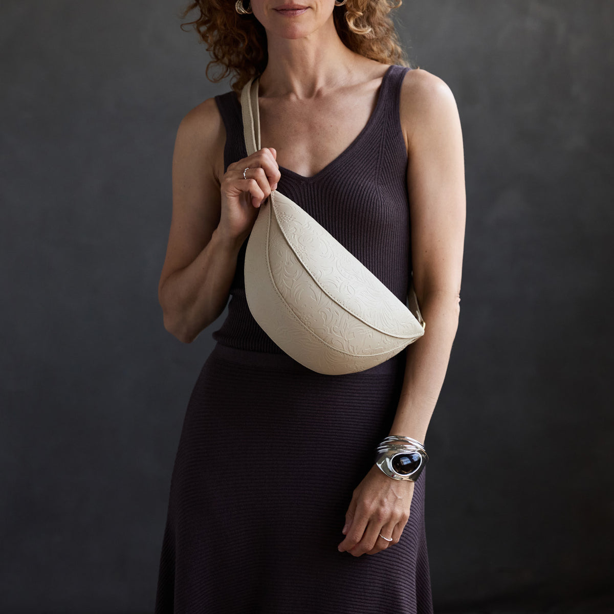 Jasmine |  Model wearing half circle shaped sling bag