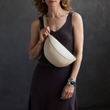 Jasmine |  Model wearing half circle shaped sling bag