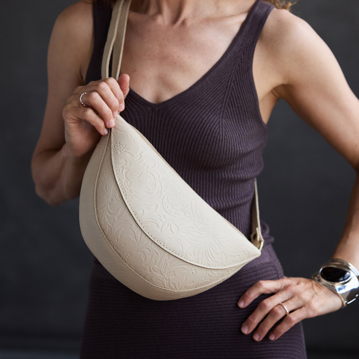 Jasmine |  Model wearing half circle shaped sling bag