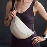 Jasmine |  Model wearing half circle shaped sling bag