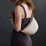 Jasmine |  Model wearing half circle shaped sling bag