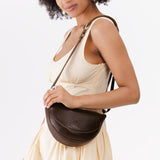 Coldbrew Small | Model wearing petite half circle shaped sling bag