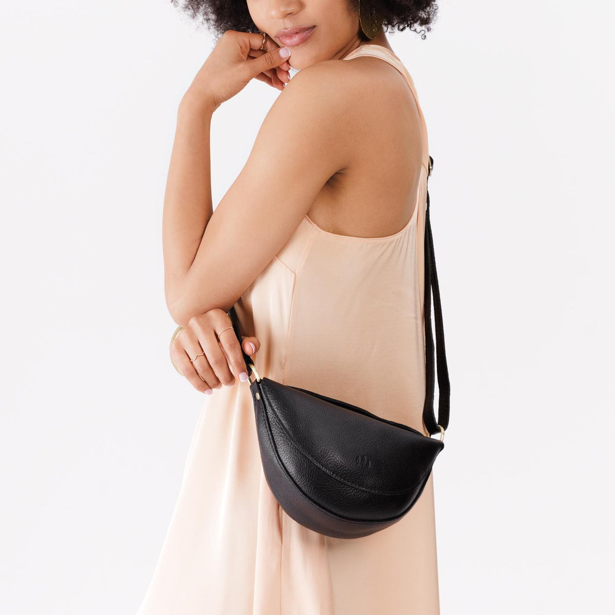 Pebbled--black*Small | Model wearing petite half circle shaped sling bag