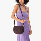 Moose Large | Model wearing a leather Crossbody with a flap and magnetic closure