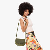 Old Growth Large | Model wearing a leather Crossbody with a flap and magnetic closure