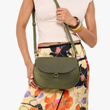 Old Growth Large | Model wearing a leather Crossbody with a flap and magnetic closure