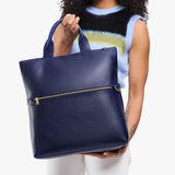 Cobalt Large | Model wearing a convertible tote clutch crossbody