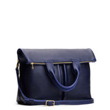 Cobalt Large | Convertible tote clutch crossbody with two large front pocket and top carry handles folded into a clutch