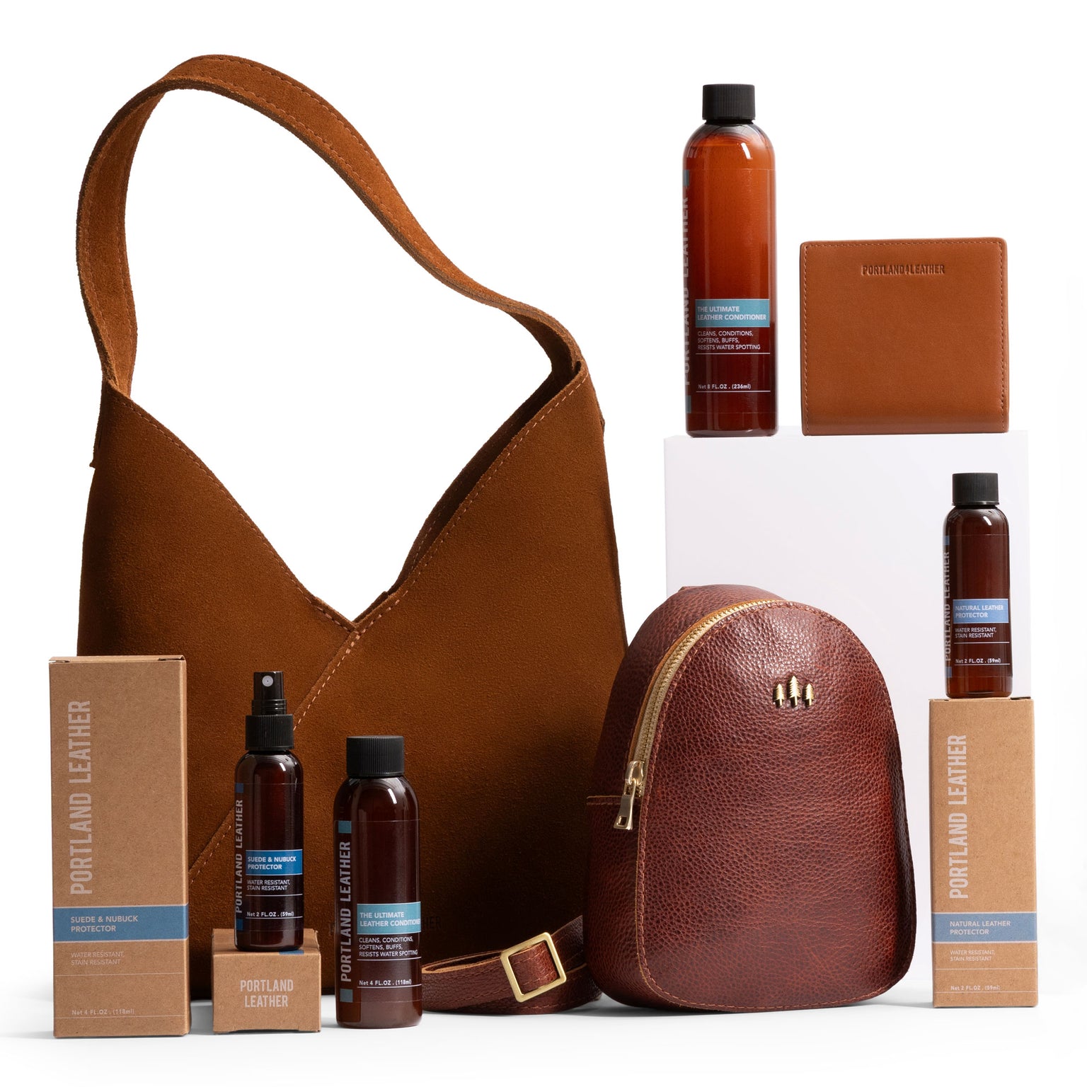 Bottles of leather care displayed with leather goods
