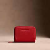 Icon Red | Wallet with card and storage pockets on a light brown background