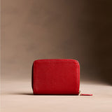 Icon Red | Wallet with card and storage pockets on a light brown background - back view