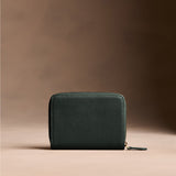 Regent Green | Wallet with card and storage pockets on a light brown background - back view