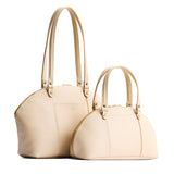 Pebbled Bone | Size comparison of the large and small half circle crossbody bag with handles and removable crossbody strap 