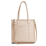 Pebbled Bone North/South | Structured large tote bag with overlapping panels and crossbody strap