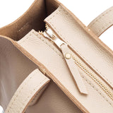 Pebbled Bone | Closeup of tote bag's zipper closure
