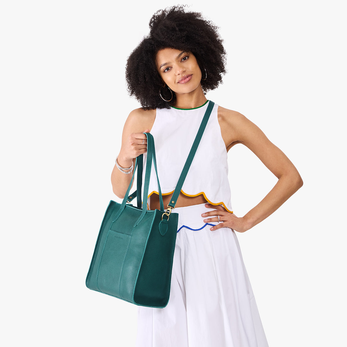 Sea Glass*North/South | Model wearing structured large tote bag with overlapping panels and crossbody strap