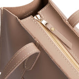 Stone | Closeup of tote bag's zipper closure