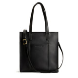 Black North/South | Structured large tote bag with overlapping panels and crossbody strap