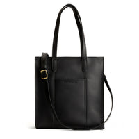 Black*North/South | Structured large tote bag with overlapping panels and crossbody strap