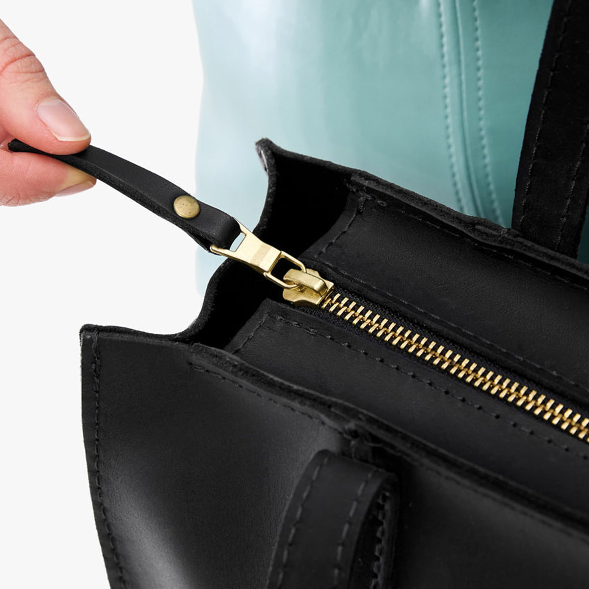 Black | Structured large tote bag with overlapping panels and crossbody strap
