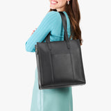 Black North/South | Structured large tote bag with overlapping panels and crossbody strap