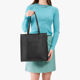 Black North/South | Structured large tote bag with overlapping panels and crossbody strap