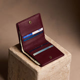 Hunter Small | Petite slim leather bifold wallet with multiple card slots and a zippered back pocket