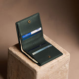Regent Green Small | Petite slim leather bifold wallet with multiple card slots and a zippered back pocket