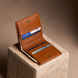 Vintage Tan Small | Petite slim leather bifold wallet with multiple card slots and a zippered back pocket