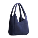 Alaska Blue Medium | U-shaped, flat-bottomed leather shoulder bag with two outside pockets