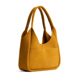 Dijon Medium | U-shaped, flat-bottomed leather shoulder bag with two outside pockets