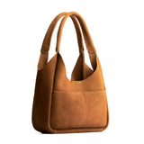 Jackson Medium | U-shaped, flat-bottomed leather shoulder bag with two outside pockets