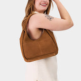 Jackson Medium | U-shaped, flat-bottomed leather shoulder bag with two outside pockets