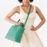 Reef | Midsize crossbody tote with handles and a pocket