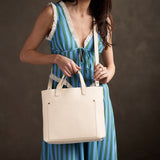 Pebbled Bone | Midsize crossbody tote with handles and a pocket