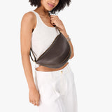 Grizzly Medium | Model wearing petite half circle shaped sling bag