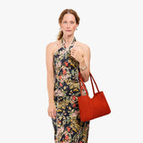 Paprika Medium | Model holding midsize rectangular tote bag