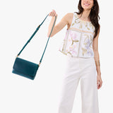 Westward Blue Medium | Model Wearing Small Leather Crossbody Bag with Magnetic Messenger Bag Closure