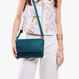Westward Blue Medium | Model Wearing Small Leather Crossbody Bag with Magnetic Messenger Bag Closure