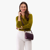 Plum Mini | Model Wearing Small Leather Crossbody Bag with Magnetic Messenger Bag Closure