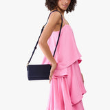 Velvet Blue Mini | Model Wearing Small Leather Crossbody Bag with Magnetic Messenger Bag Closure