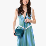 Westward Blue Mini | Model Wearing Small Leather Crossbody Bag with Magnetic Messenger Bag Closure