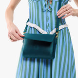 Westward Blue Mini | Model Wearing Small Leather Crossbody Bag with Magnetic Messenger Bag Closure