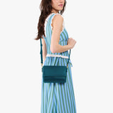 Westward Blue Mini | Model Wearing Small Leather Crossbody Bag with Magnetic Messenger Bag Closure