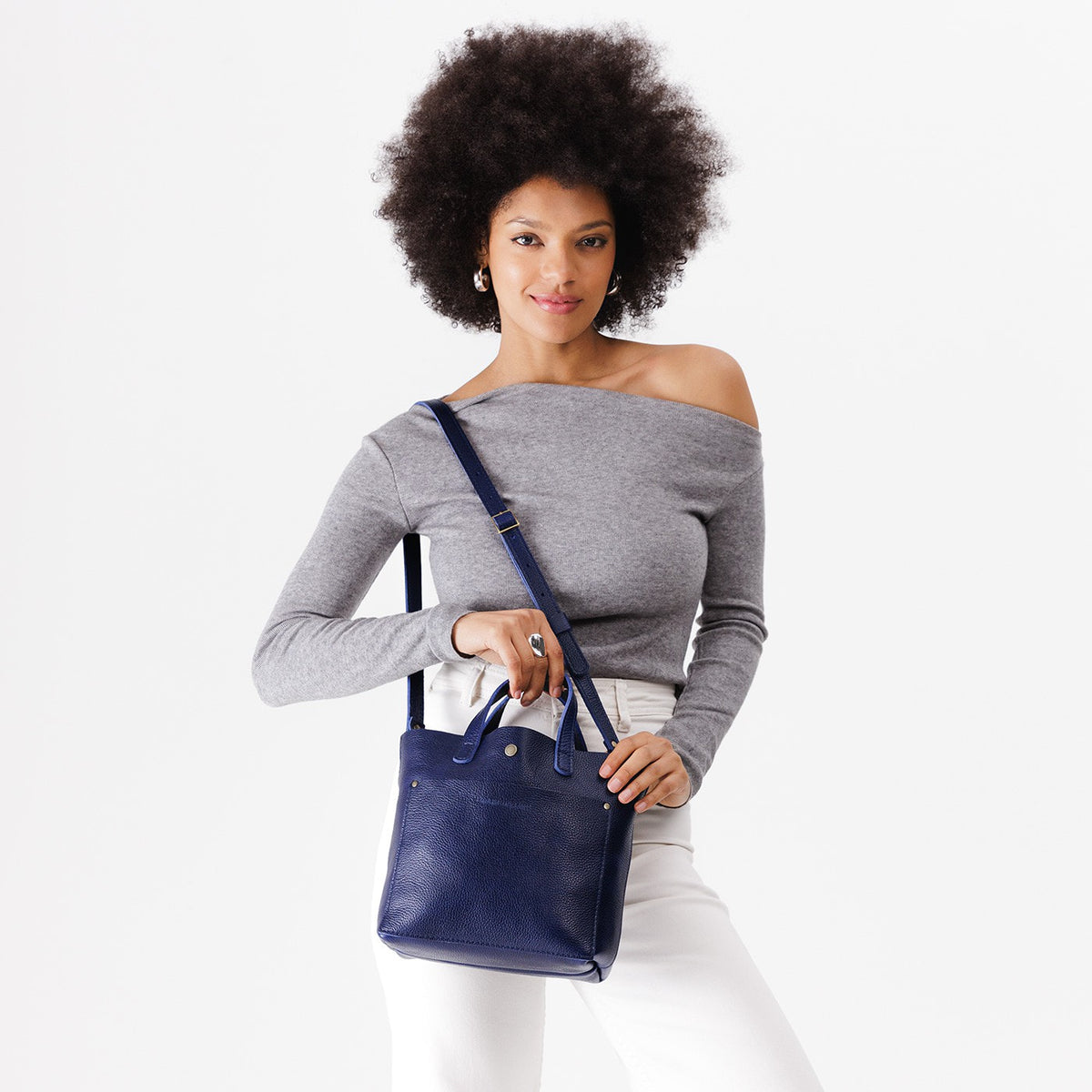 Cobalt*Classic | Model wearing crossbody tote bag with snap closure and front pocket