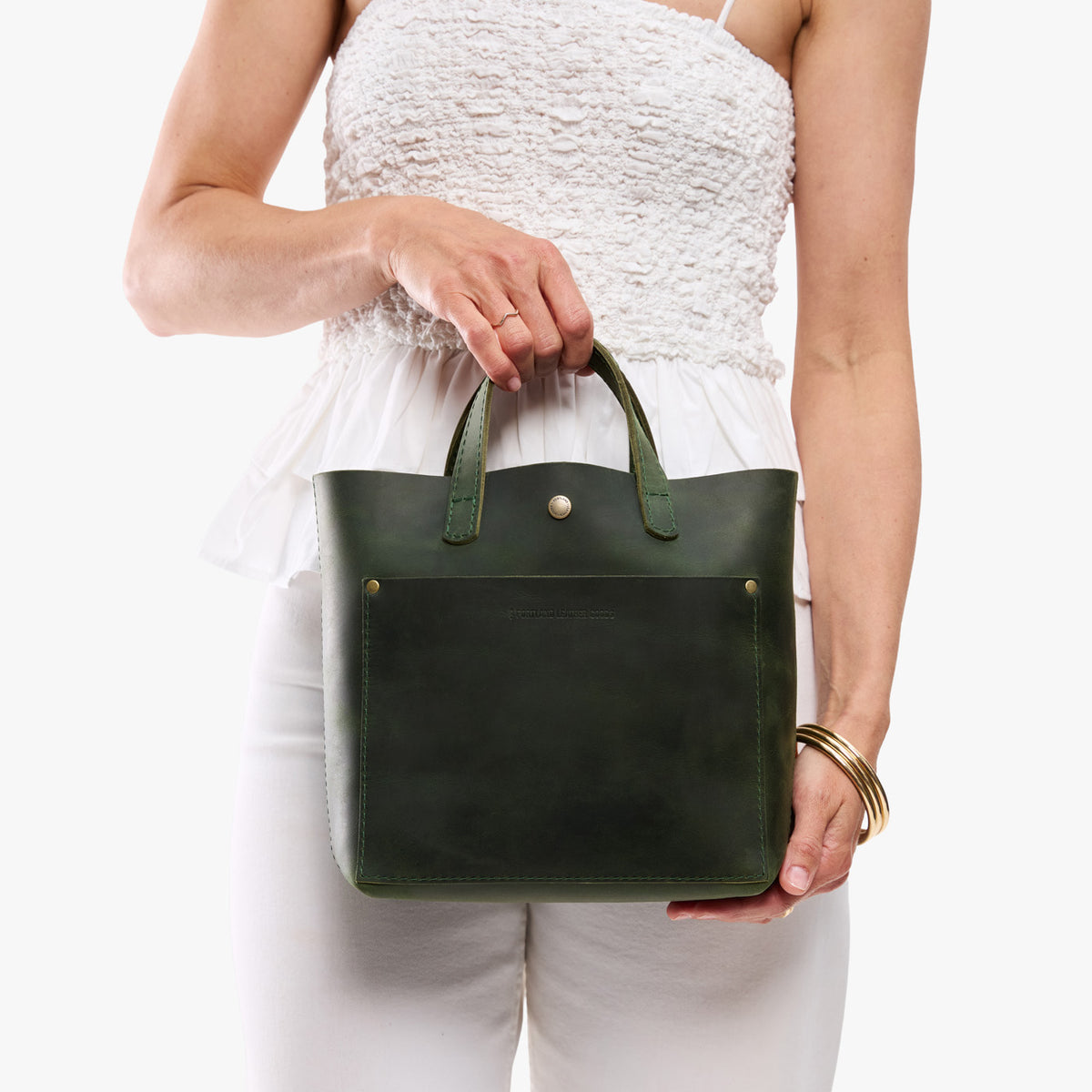 Evergreen*Classic | Model carrying crossbody tote bag with snap closure and front pocket