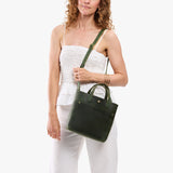 Evergreen Classic | Model carrying crossbody tote bag with snap closure and front pocket