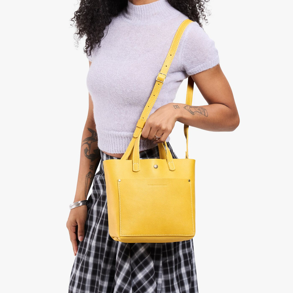 Pomello*Classic | Model wearing crossbody tote bag with snap closure and front pocket