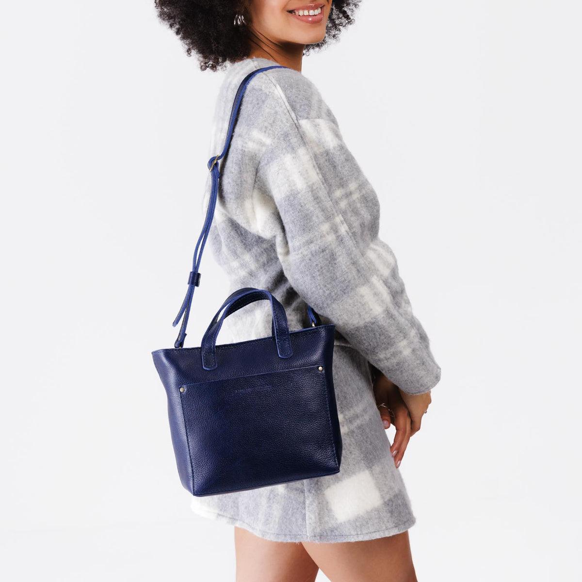 Cobalt*Zipper | Model wearing crossbody tote bag with zipper closure and front pocket